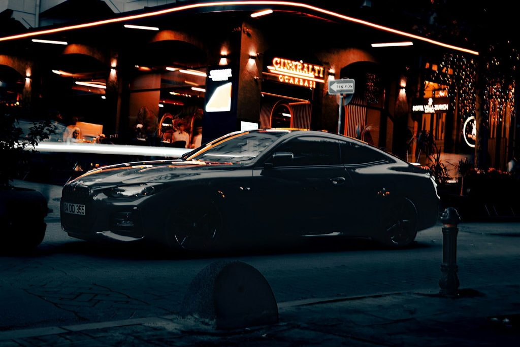 dark bmw car parked at night